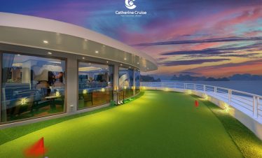 Luxurious cruise deck with panoramic sunset views in Vietnam.