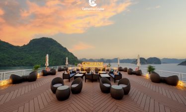 Relaxing cruise deck with scenic island views at sunset, luxurious outdoor seating, and personalized service.