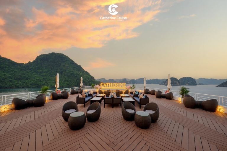 Relaxing cruise deck with scenic island views at sunset, luxurious outdoor seating, and personalized service.