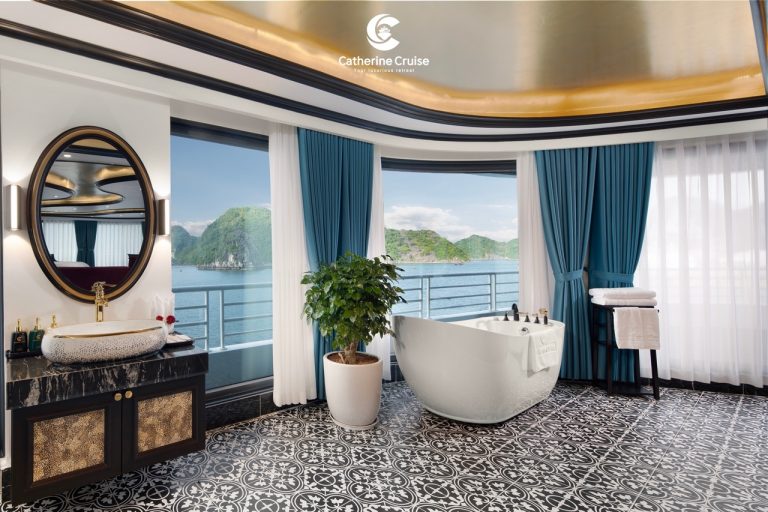 Luxury cruise bathroom with ocean view, bathtub, elegant decor, and sea landscape.