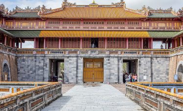 Vivid scene of Hue Imperial Palace showcasing traditional Vietnamese architecture and cultural herit.