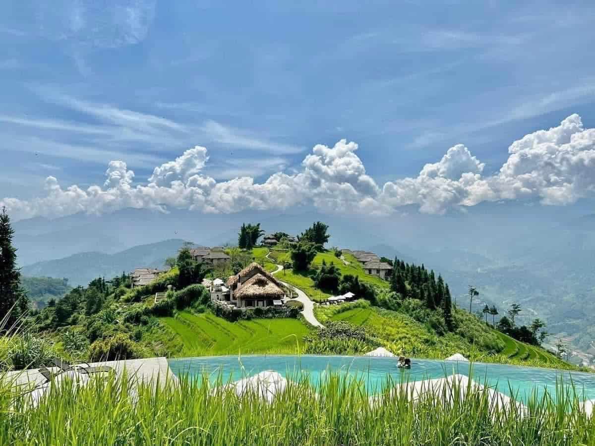 Stunning mountain landscape with lush greenery and traditional village views in Sapa.