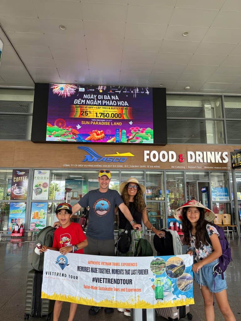 A family begins their Vietnam adventure at Da Nang Airport with ViettrendTour.