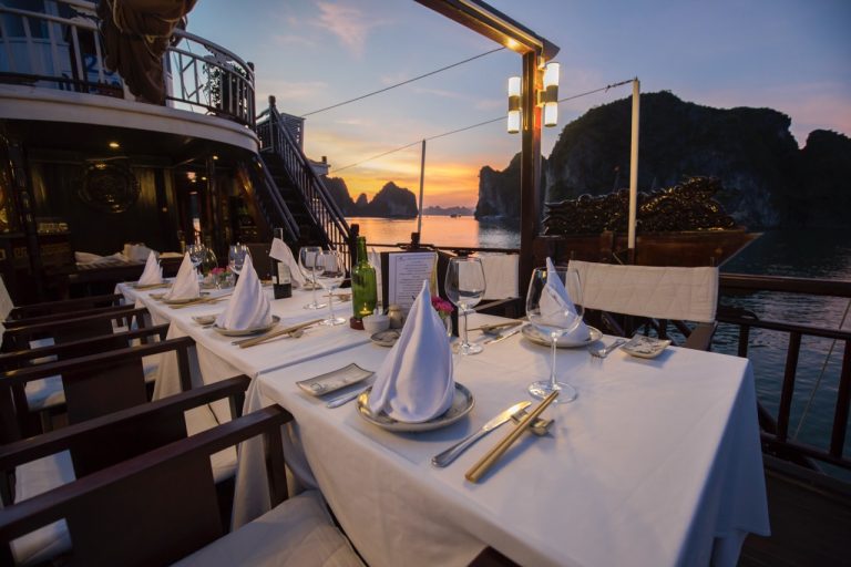 Golden hour unfolds as the first course arrives—good food, gentle conversation, unforgettable views.