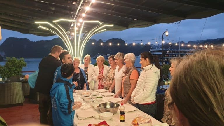 Hands-on fun on the sundeckยroll fresh spring rolls, laugh with new friends, taste Vietnam together.