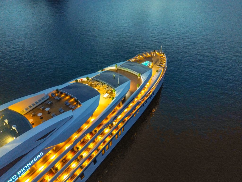 Luxury cruise yacht at sunset, Vietnam travel, scenic boat tour for vacation.