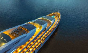 Luxury cruise yacht at sunset, Vietnam travel, scenic boat tour for vacation.