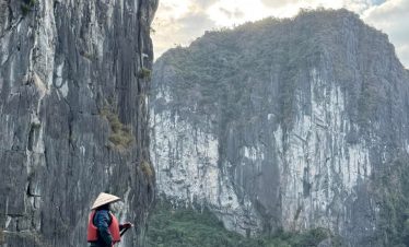 1. boat tour exploring Halong Bay with limestone karsts and lush islands.