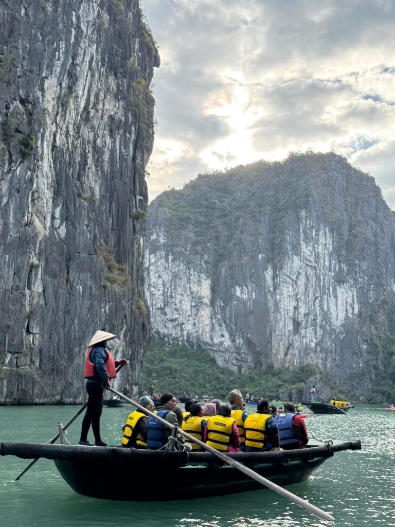 1. boat tour exploring Halong Bay with limestone karsts and lush islands.
