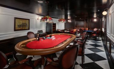 Luxurious casino poker room with elegant decor and classic gaming tables in Vietnam.