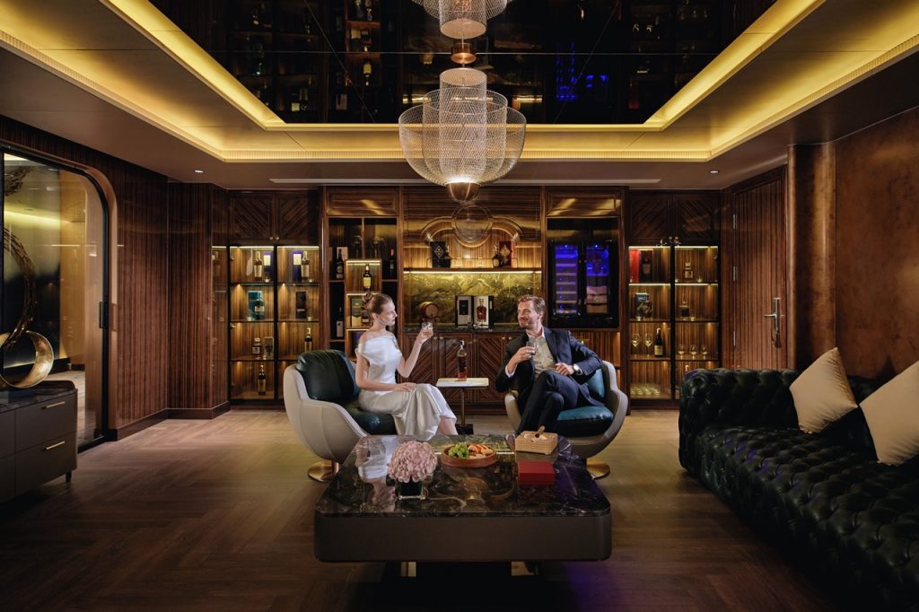 Elegant lounge with luxurious wood-paneled walls and modern lighting, perfect for upscale relaxation.