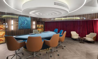 Luxurious poker room with modern design and comfortable seating for high-stakes gaming in Vietnam.