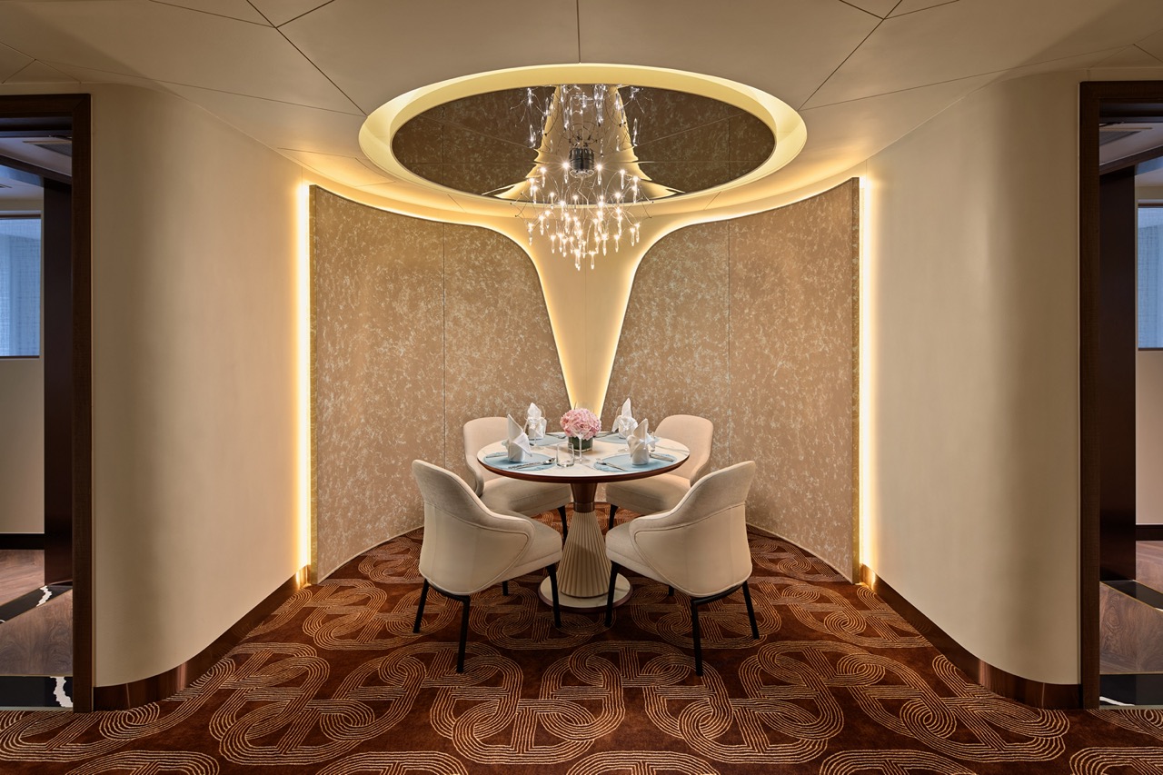 Elegant private dining area with luxurious decor, chandelier, and intimate ambiance for special occasions.