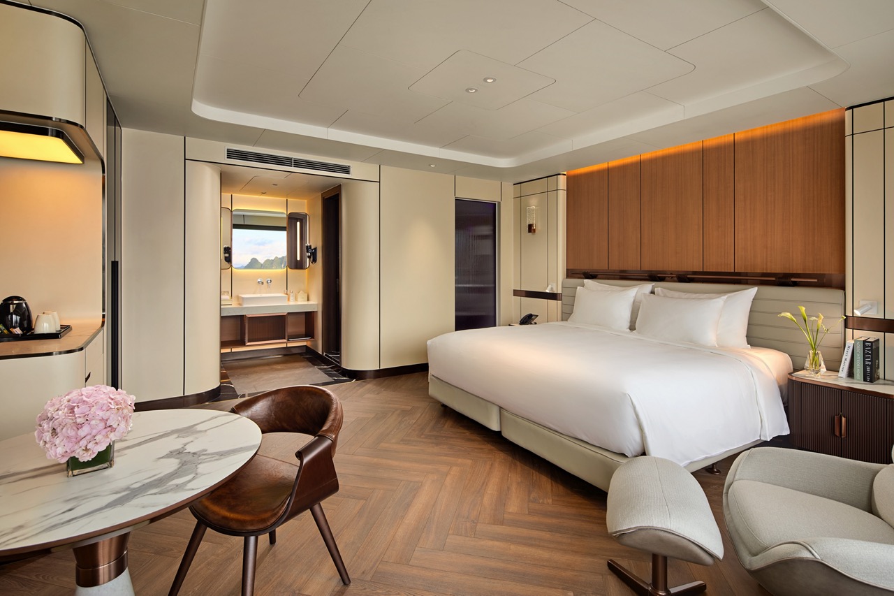 Luxury hotel room with modern decor and king-sized bed, perfect for vacation or business trips.