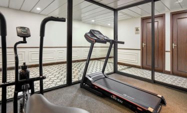 Modern treadmill in hotel gym for fitness and wellness.