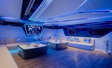 Elegant modern lounge with LED lighting and stylish decor for luxury entertainment.