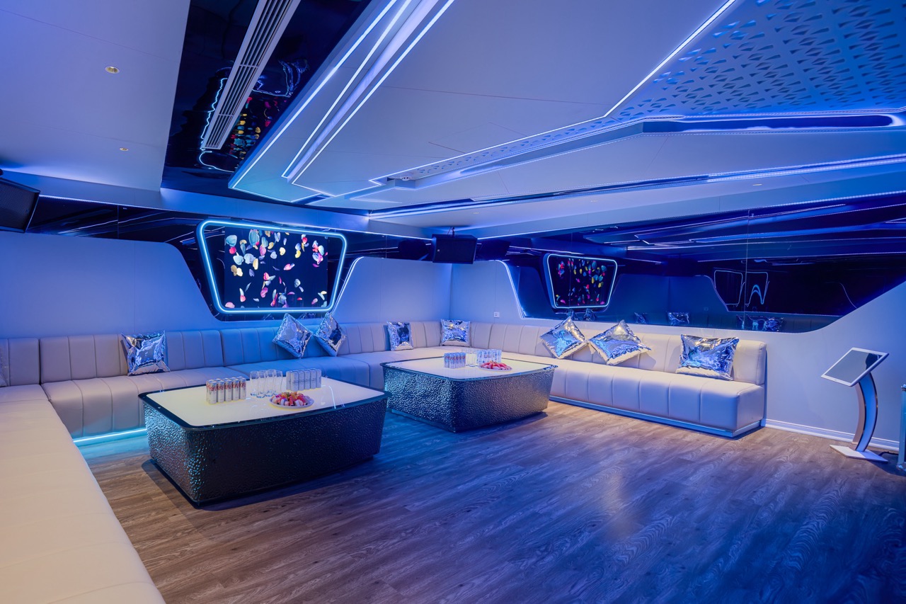 Elegant modern lounge with LED lighting and stylish decor for luxury entertainment.