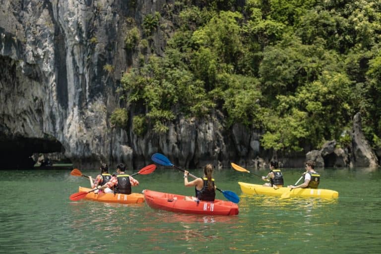 Paddle through jade-green water into hidden lagoons near Luon Cave—fun for couples, friends, and families. Customize your adventure with ViettrendTour. WhatsApp (+84) 898265688.