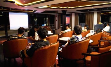 Relaxed movie screening in a cozy luxury theater room, perfect for private events and group entertainment.