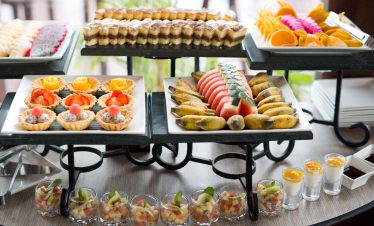 Delicious assorted fruit desserts and pastries for tourists at ViettrendTour buffet.
