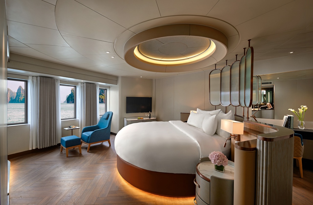 Elegant hotel bedroom with panoramic ocean views and modern amenities, perfect for luxury travel.