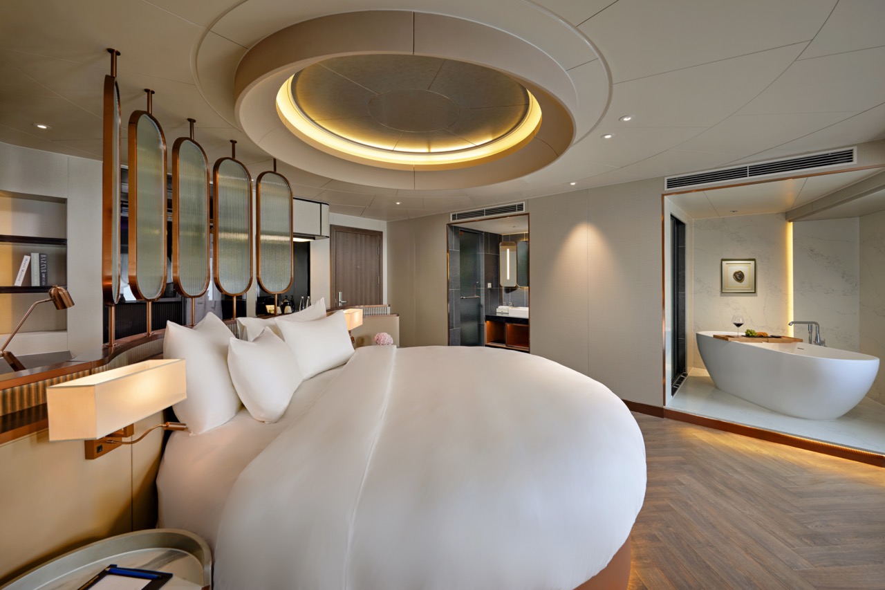 Luxurious hotel bedroom with modern design, premium bedding, and elegant decor.