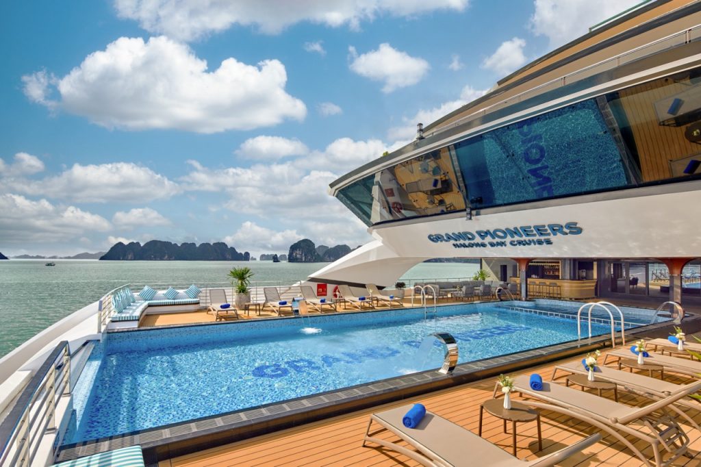 Luxurious yacht with rooftop pool and sea view, perfect for Vietnam cruise vacations.