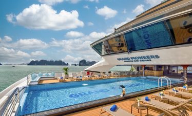 Luxurious yacht with rooftop pool and sea view, perfect for Vietnam cruise vacations.