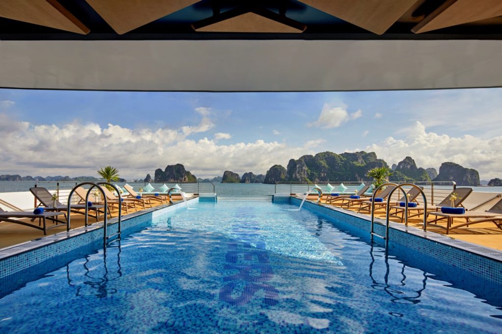 Luxurious rooftop infinity pool with sea view and island scenery in Vietnam.