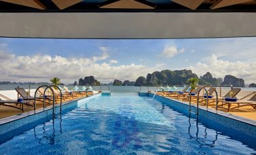 Luxurious rooftop infinity pool with sea view and island scenery in Vietnam.