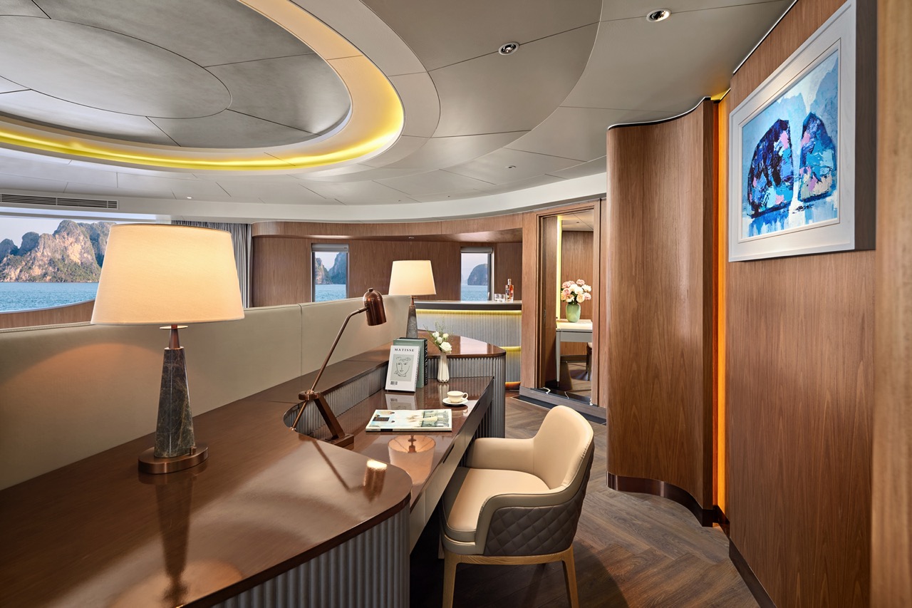 Elegant yacht interior with wooden accents and ocean views, luxury cruise experience.
