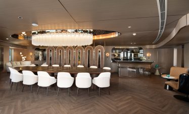 Elegant modern dining room with luxurious ambiance and stylish furniture.