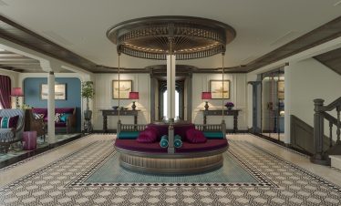 Luxurious hotel lobby with elegant decor and seating, showcasing high-end interior design.