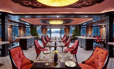 Luxurious restaurant dining room with elegant decor and scenic water views, perfect for fine dining experiences.