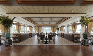 Luxurious waterfront restaurant with large windows and elegant decor.