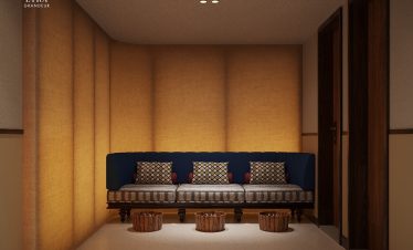 Luxurious hotel lobby with elegant blue velvet sofa and warm wood accents – perfect for relaxation.