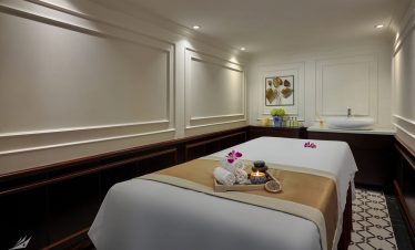Calm spa massage room with elegant decor, soft lighting, and relaxing ambiance.