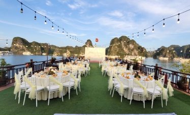 Luxurious outdoor dining overlooking Ha Long Bay in Vietnam, perfect for events and celebrations.