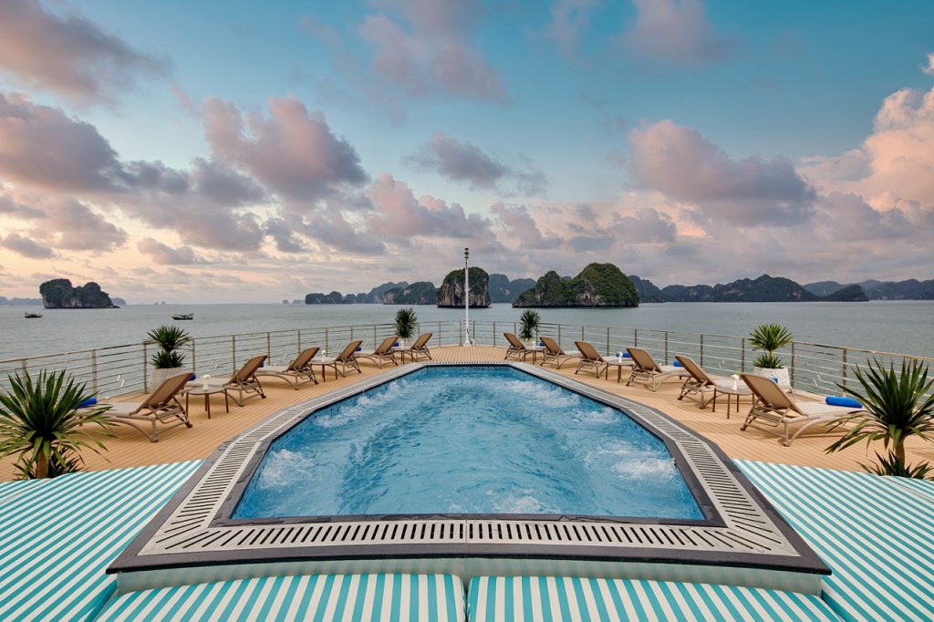 Relaxing pool deck with ocean view and island scenery in Vietnam.