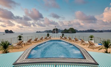 Relaxing pool deck with ocean view and island scenery in Vietnam.