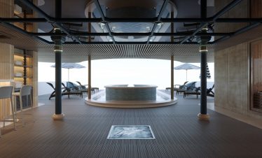 Luxurious rooftop infinity pool with sun loungers and ocean view at ViettrendTour resort.