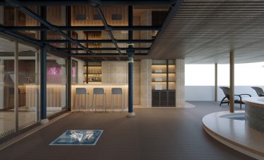 Relaxing rooftop bar overlooking ocean with pool and lounge chairs at luxury hotel.