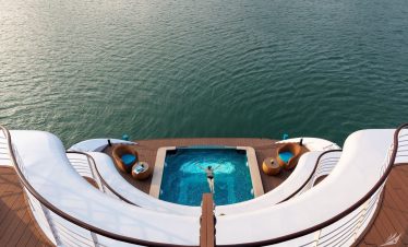 Luxurious boat deck with private pool and scenic waterview, perfect for relaxing vacations.