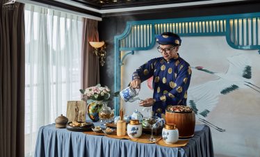 Colorful traditional tea ceremony in Vietnam with vibrant décor and elegant presentation.