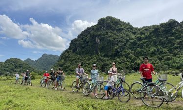 Enjoying scenic cycling tours in Vietnam's lush green mountains and countryside with ViettrendTour.