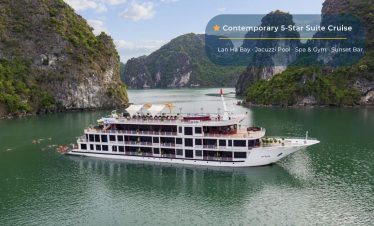 Luxury cruise ship on Lan Ha Bay with lush green limestone islands, perfect for Vietnam travel tours.