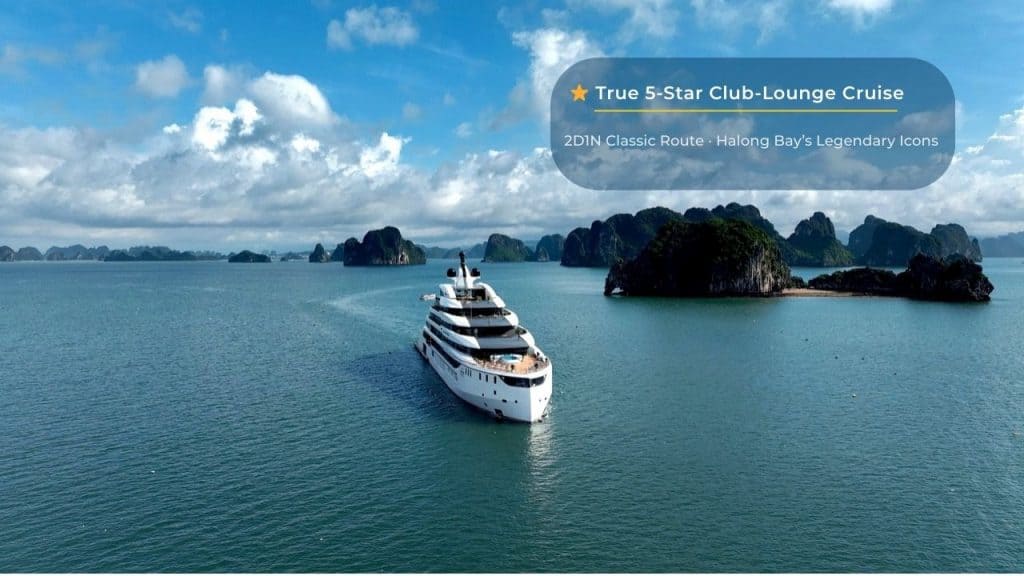 Luxury yacht cruising in Halong Bay with limestone islands, part of Vietnam's iconic UNESCO World Heritage site.