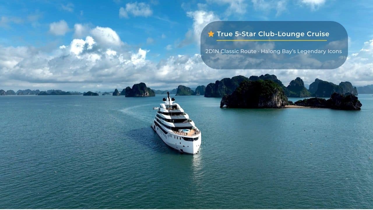 Luxury yacht cruising in Halong Bay with limestone islands, part of Vietnam's iconic UNESCO World Heritage site.