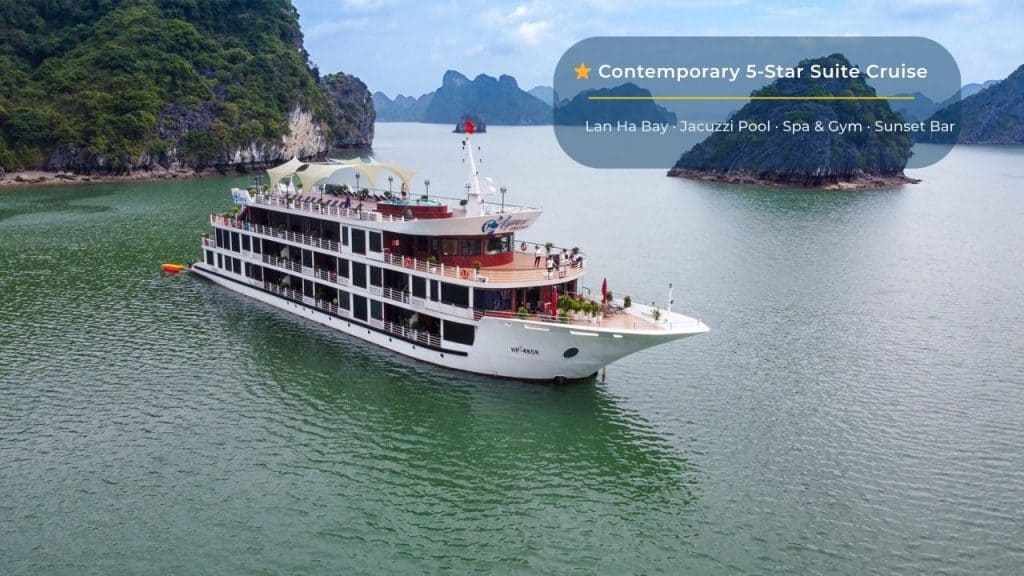 Luxury cruise ship on Lan Ha Bay with scenic limestone islands in Vietnam.