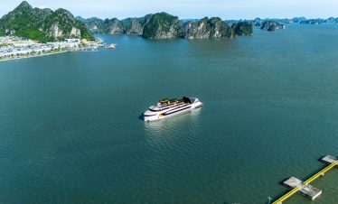 Luxury yacht cruising in Ha Long Bay, Vietnam with scenic limestone karsts.